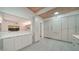 Modern kitchen with white cabinets and wood ceiling beams at 302 45Th W St, Bradenton, FL 34209