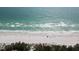 Beach with people and umbrellas at 3704 6Th Ave # 5, Holmes Beach, FL 34217