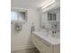 Modern bathroom with floating vanity and mirror at 3751 S School Ave # 11, Sarasota, FL 34239