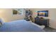 Bedroom with king bed, TV, and bike storage at 3751 S School Ave # 11, Sarasota, FL 34239