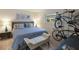 Spacious bedroom with king-size bed and bench at 3751 S School Ave # 11, Sarasota, FL 34239