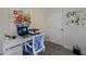 Bright home office features built-in desk, printer, and art at 3751 S School Ave # 11, Sarasota, FL 34239