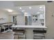 Open concept kitchen with breakfast bar and stainless steel appliances at 3751 S School Ave # 11, Sarasota, FL 34239