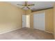 Bedroom with ceiling fan and closet at 3915 Fonsica Ave, North Port, FL 34286