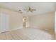 Bright bedroom with ceiling fan and tile floors at 3915 Fonsica Ave, North Port, FL 34286