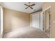 Spacious bedroom with ceiling fan and double door closet at 3915 Fonsica Ave, North Port, FL 34286