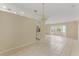 Spacious dining room with tile flooring and access to the kitchen at 3915 Fonsica Ave, North Port, FL 34286