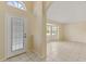 Bright entryway with tile flooring and views into the living room at 3915 Fonsica Ave, North Port, FL 34286
