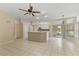 Open kitchen with island and view into Gathering room and backyard at 3915 Fonsica Ave, North Port, FL 34286