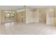 Open living space with tile floors and access to kitchen and other rooms at 3915 Fonsica Ave, North Port, FL 34286