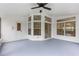 Bright screened porch with ceiling fan and access to backyard at 3915 Fonsica Ave, North Port, FL 34286