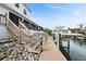 Private boat dock with steps leading to the water at 432 Sorrento Dr, Osprey, FL 34229