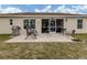 Home with screened patio, grassy yard, and paver patio at 4352 Adelaide Ave, North Port, FL 34288