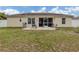 Home with screened patio, grassy yard, and paver patio at 4352 Adelaide Ave, North Port, FL 34288