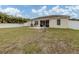 Home with screened patio, grassy yard, and paver patio at 4352 Adelaide Ave, North Port, FL 34288