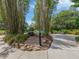 Tranquil bamboo garden with a stone path and informational sign at 4352 Adelaide Ave, North Port, FL 34288