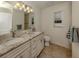 Elegant bathroom with double vanity and granite countertops at 4352 Adelaide Ave, North Port, FL 34288