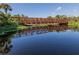 Metal footbridge over calm lake water at 4352 Adelaide Ave, North Port, FL 34288