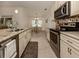 Open concept kitchen with granite countertops and stainless steel appliances at 4352 Adelaide Ave, North Port, FL 34288