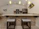 Kitchen island with granite countertop and two gray stools at 4352 Adelaide Ave, North Port, FL 34288