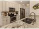 Modern kitchen with granite countertops and stainless steel appliances at 4352 Adelaide Ave, North Port, FL 34288