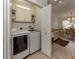 Convenient laundry room with washer, dryer, and cabinets at 4352 Adelaide Ave, North Port, FL 34288