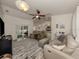 Spacious living room with comfortable seating and large area rug at 4352 Adelaide Ave, North Port, FL 34288