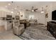 Living room with comfortable seating, large rug, and open layout at 4352 Adelaide Ave, North Port, FL 34288