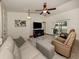 Spacious living room featuring a comfortable seating area and sliding glass doors at 4352 Adelaide Ave, North Port, FL 34288