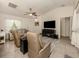 Bright living room with comfy seating and a large TV at 4352 Adelaide Ave, North Port, FL 34288
