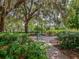 Relaxing park bench under a large shade tree at 4352 Adelaide Ave, North Port, FL 34288