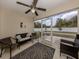 Relaxing screened porch with wicker furniture and view of backyard at 4352 Adelaide Ave, North Port, FL 34288
