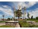 Abstract metal sculpture of three figures in a landscaped area at 4352 Adelaide Ave, North Port, FL 34288