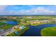 Wide aerial view of community with lake and homes at 4517 Mondrian Ct, Sarasota, FL 34240