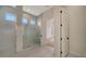 Modern bathroom with a large walk-in shower and separate room access at 4517 Mondrian Ct, Sarasota, FL 34240