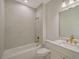Modern bathroom with marble tile and gold fixtures at 4517 Mondrian Ct, Sarasota, FL 34240