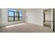 Bright bedroom with carpeting, large window, and access to other rooms at 4517 Mondrian Ct, Sarasota, FL 34240