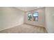 Spacious bedroom with neutral carpeting and large windows at 4517 Mondrian Ct, Sarasota, FL 34240