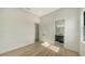 Bright bedroom with wood flooring and bathroom access at 4517 Mondrian Ct, Sarasota, FL 34240