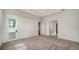 Spacious bedroom with carpet flooring and access to multiple rooms at 4517 Mondrian Ct, Sarasota, FL 34240