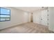 Spacious bedroom with walk-in closet and lake view at 4517 Mondrian Ct, Sarasota, FL 34240
