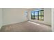 Spacious bedroom with large window and water view at 4517 Mondrian Ct, Sarasota, FL 34240
