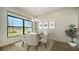 Bright dining room with water views and round table at 4517 Mondrian Ct, Sarasota, FL 34240