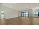 Open living area featuring sliding doors to a lake view at 4517 Mondrian Ct, Sarasota, FL 34240