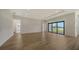 Open living area featuring sliding doors to a lake view at 4517 Mondrian Ct, Sarasota, FL 34240