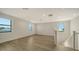 Bright loft with hardwood floors and multiple windows, overlooking the main floor at 4517 Mondrian Ct, Sarasota, FL 34240