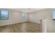 Spacious loft area with hardwood floors and multiple windows at 4517 Mondrian Ct, Sarasota, FL 34240