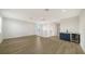 Loft area with hardwood floors, wet bar, and staircase at 4517 Mondrian Ct, Sarasota, FL 34240