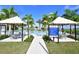 Community pool with cabanas and plenty of seating at 4517 Mondrian Ct, Sarasota, FL 34240
