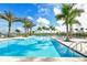 Resort-style pool with lounge chairs and palm trees at 4517 Mondrian Ct, Sarasota, FL 34240